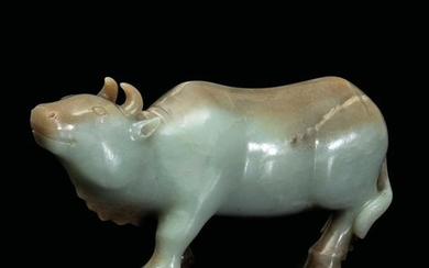 A Celadon jade and russet ox, China, Qing Dynasty
