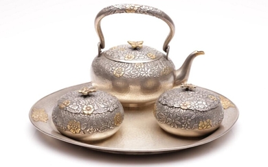 A Chinese Silver Tea Service with 24ct goldplated decorations and butterfly finials, (total combined wt. 1.498kg)