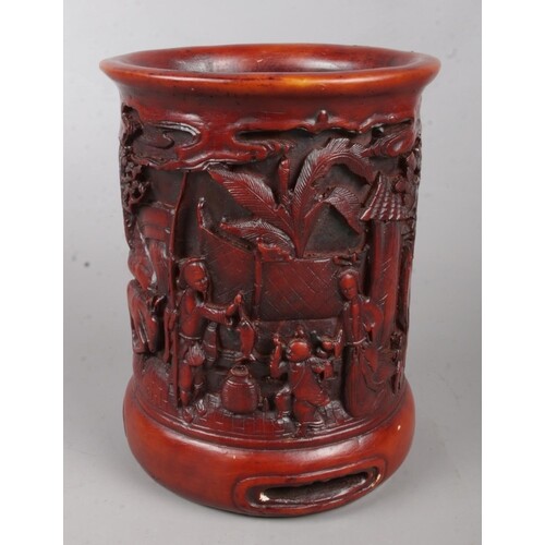 A Chinese boxwood brush pot. With carved landscape and figur...