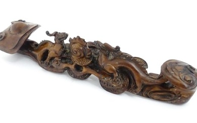 A Chinese carved hardwood ruyi sceptre with dragons and flaming pearl decoration. Approx. 16 3/4"