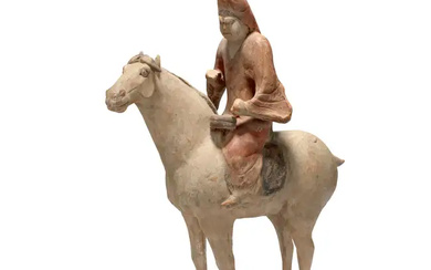 A Chinese painted pottery figure of a musician on horseback Tang dynasty...
