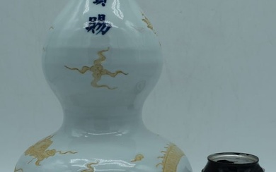 A Chinese porcelain Double Gourd vase decorated with an unglazed Dragon in relief 33 cm.