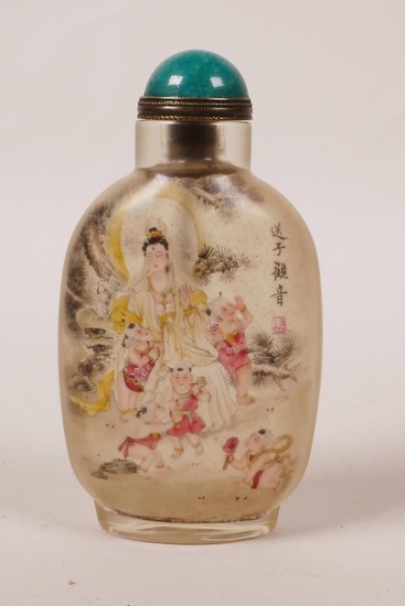A Chinese reverse painted glass snuff bottle decorated with ...