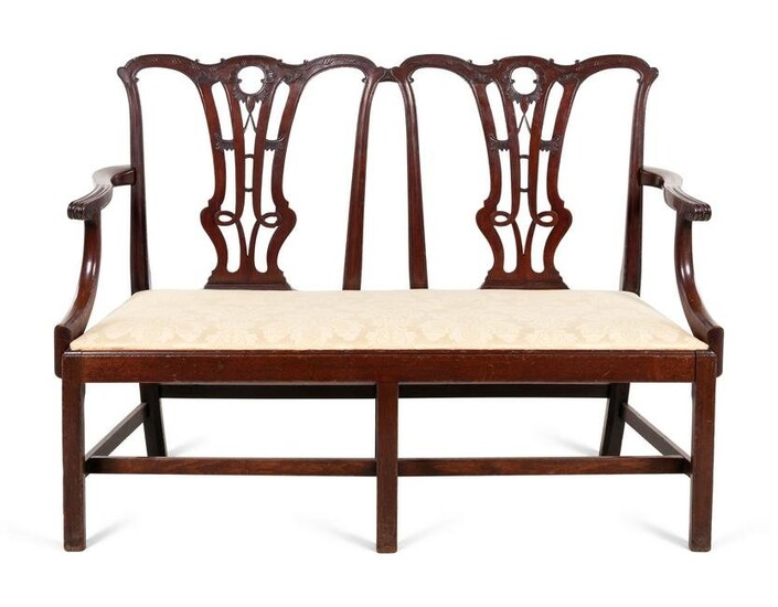 A George III Style Carved Mahogany Double-Back Settee