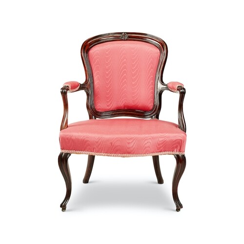 A George III carved mahogany open armchair In the French Hep...