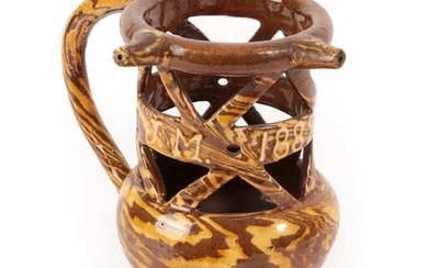 A Halifax Slipware Puzzle Jug, dated 1889, of traditional form...