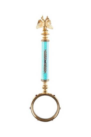 A JEWELLED SILVER-GILT AND GUILLOCHÉ ENAMEL MAGNIFYING GLASS 2nd half 20th century Bearing spurious Russian hallmarks and master's mark 'FABERGE' in Cyrillic. In a silk and velvet lined wood case stamped in Russian 'Fabergé. Seven and a half inches long.