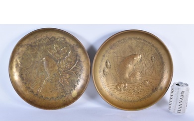 A LARGE PAIR OF ARTS AND CRAFTS BRASS REPOUSSE DISHES depict...