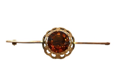 A LATE VICTORIAN/EARLY EDWARDIAN YELLOW METAL AND CITRINE BAR...