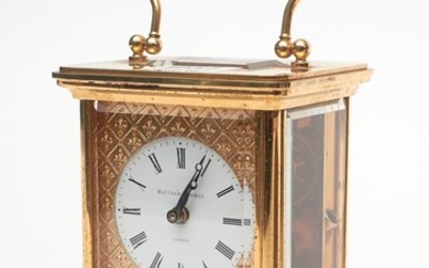 A MATTHEW NORMAN BRASS CARRIAGE CLOCK WITH KEY H.11CM