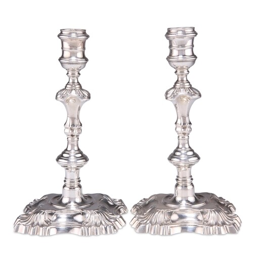 A PAIR OF GEORGE II CAST SILVER CANDLESTICKS, by Thomas Gilp...