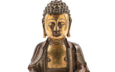 A PARCEL-GILT BRONZE FIGURE OF BUDDHA
