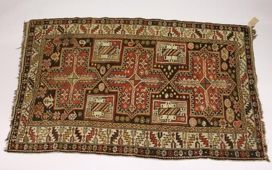 A PERSIAN CAUCASIAN RUG, EARLY 20TH CENTURY, with three
