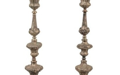 A Pair of Baroque Repousse Decorated Silvered Metal