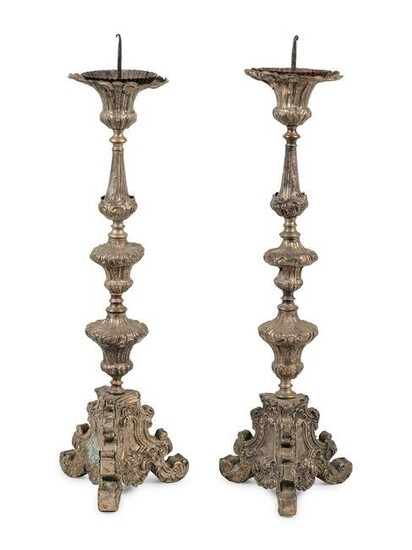 A Pair of Baroque Repousse Decorated Silvered Metal