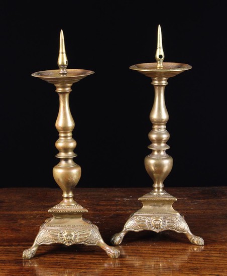 A Pair of Continental Bronze Pricket candlesticks, Circa 1800. The prickets on drip pans above knopp
