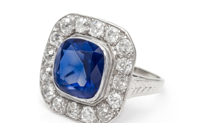 A Platinum, White Gold, Synthetic Sapphire and Diamond Ring