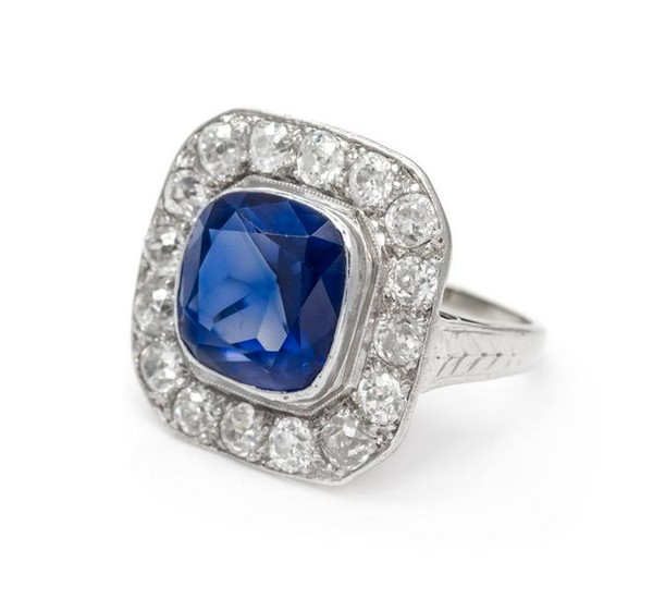A Platinum, White Gold, Synthetic Sapphire and Diamond
