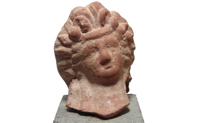 A Ptolemaic Greek ceramic head of a woman