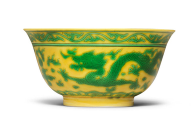 A RARE YELLOW-GROUND GREEN-ENAMELLED 'DRAGON' BOWL Qianlong seal mark and...