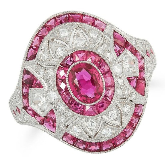 A RUBY AND DIAMOND DRESS RING set with a central oval