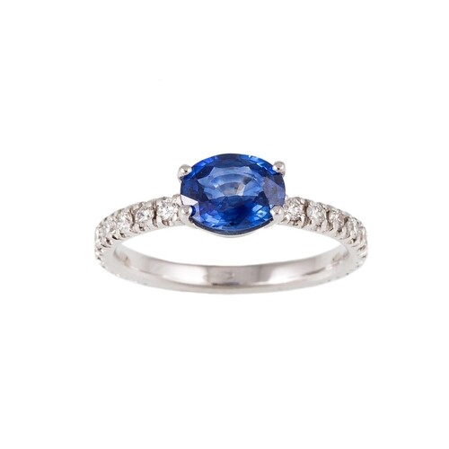 A SAPPHIRE SINGLE STONE RING, the oval sapphire to brilliant...