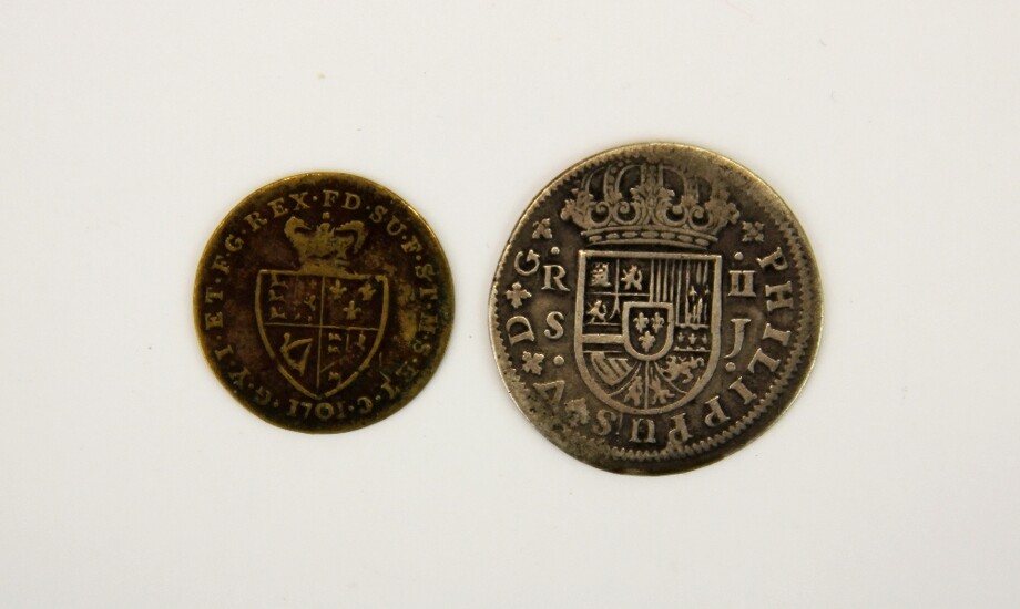 A Spanish Philip V of Spain 1722 silver coin together with a King George III half guinea gaming token.