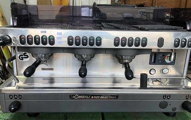 A THREE HEAD COFFEE MACHINE