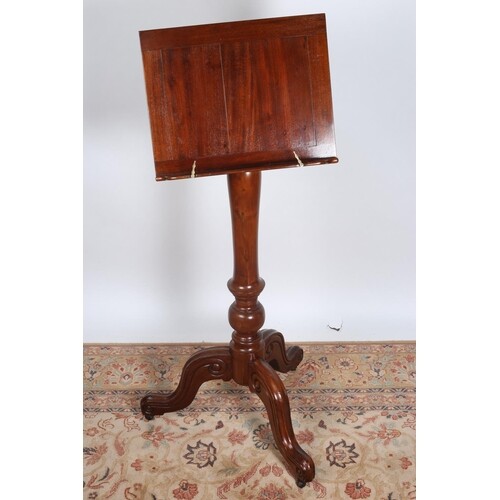 A VICTORIAN MAHOGANY LECTERN raised on a turned column and t...