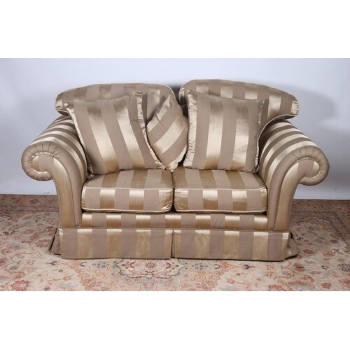 A VICTORIAN STYLE SETTEE with striped upholstery and loose c...