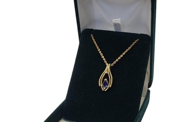 A VINTAGE 18CT GOLD, SAPPHIRE AND DIAMOND PENDANT NECKLACE T...