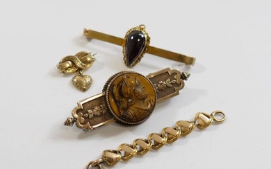 A Victorian brooch set with circular tiger's eye carved in r...