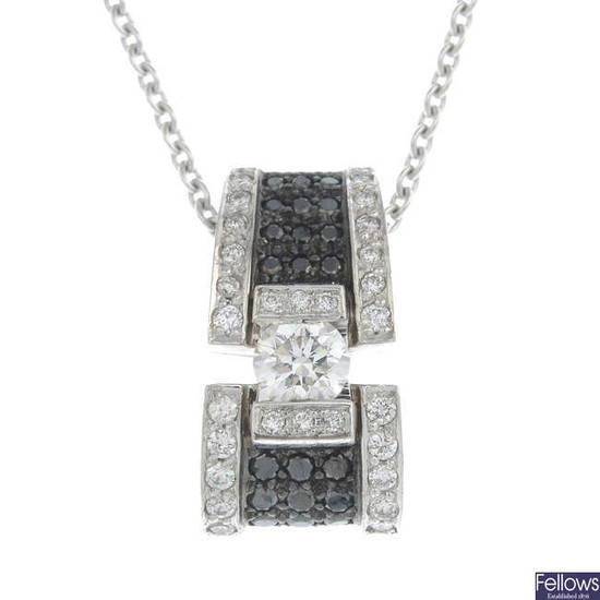 A brilliant-cut diamond and black gem pendant, with chain.