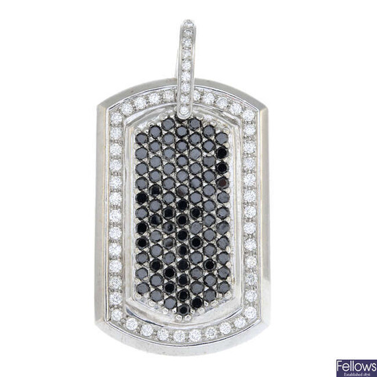 A brilliant-cut diamond and black gem pendant.