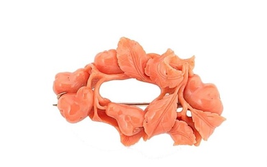 A carved coral brooch