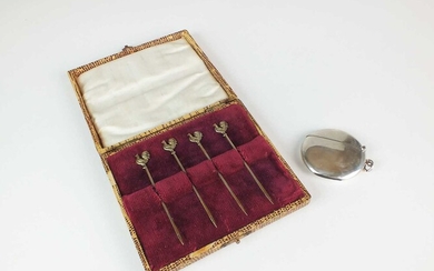 A cased set of four silver gilt cocktail sticks and a silver vesta case