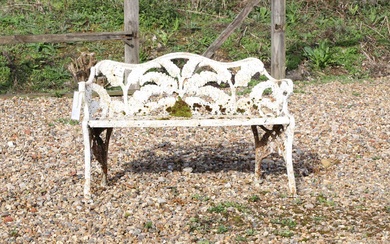 A cast iron fern pattern garden seat
