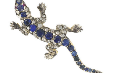 A diamond and sapphire lizard brooch
