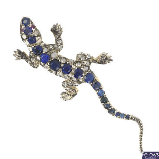 A diamond and sapphire lizard brooch