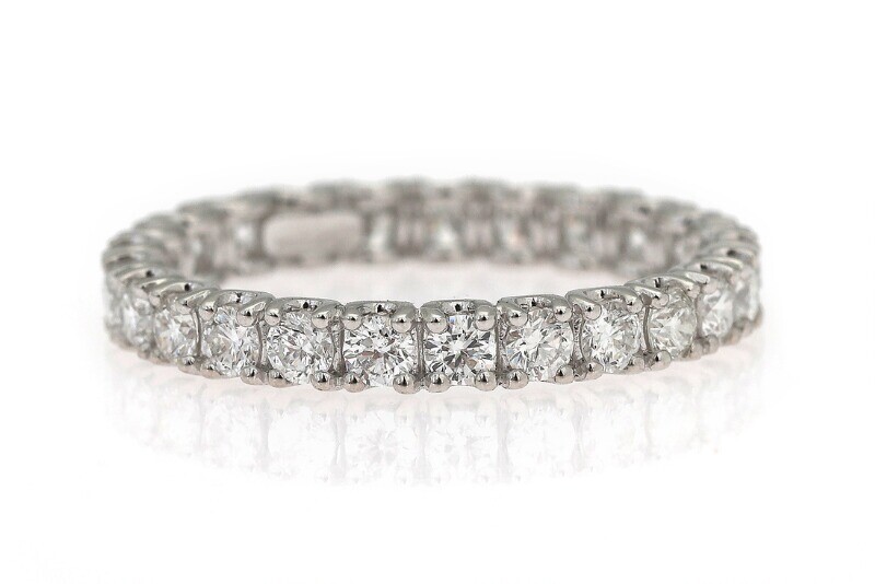 NOT SOLD. A diamond eternity ring set with numerous diamonds weighing a total of app....