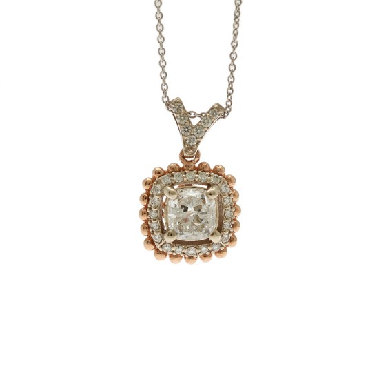 A diamond pendant set with a cushion-cut and numerous brilliant-cut diamonds, mounted in 14k white and rose gold, on a 14k white gold necklace. (2)