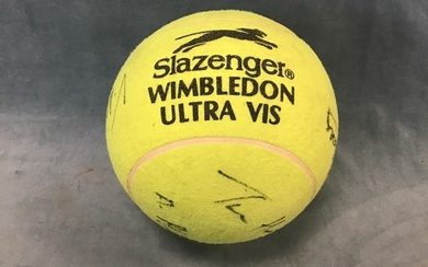 A giant autographed tennis ball, bearing the signatures of Andre...