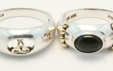 A group of 4 sterling & gold rings