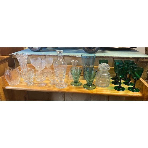 A group of glassware, including seven green glasses, two rib...