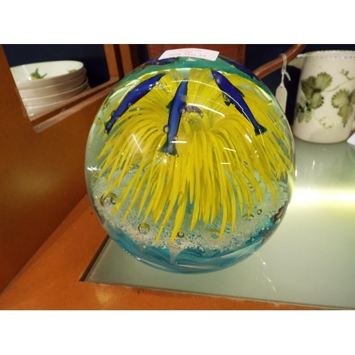A large Murano glass paperweight with bubble and fish inclus...
