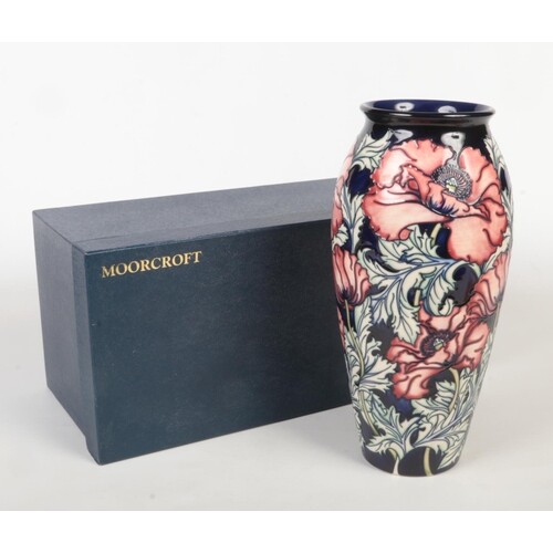 A large contemporary Moorcroft pottery vase in box. Designed...