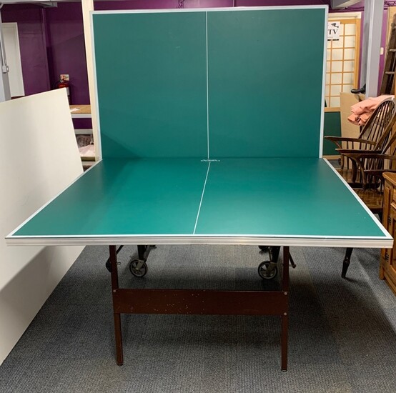 A large folding full size table tennis table.