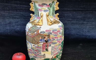 A large vintage Japanese hand painted porcelain vase depicti...