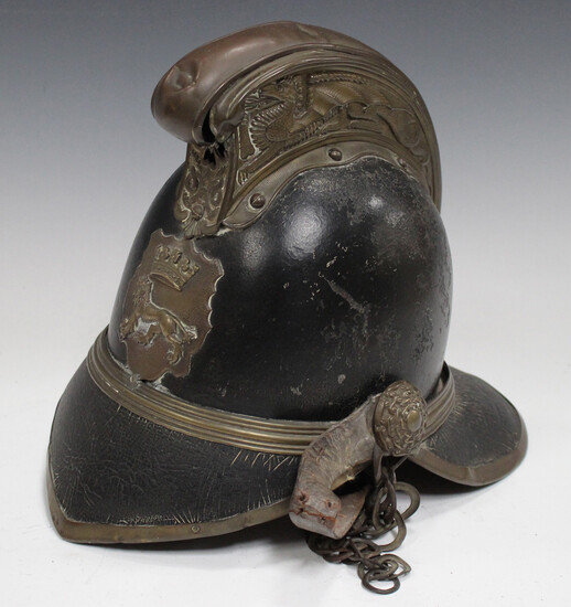 A late 19th/early 20th century black leather and brass mounted Merryweather type fireman's helm