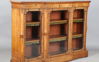 A late Victorian Aesthetic Movement oak breakfront credenza, in the manner of Charles Bevan, inlaid